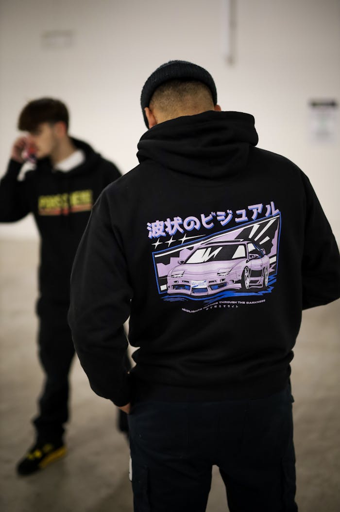 Men's streetwear fashion hoodies with vibrant car graphics and Japanese text.